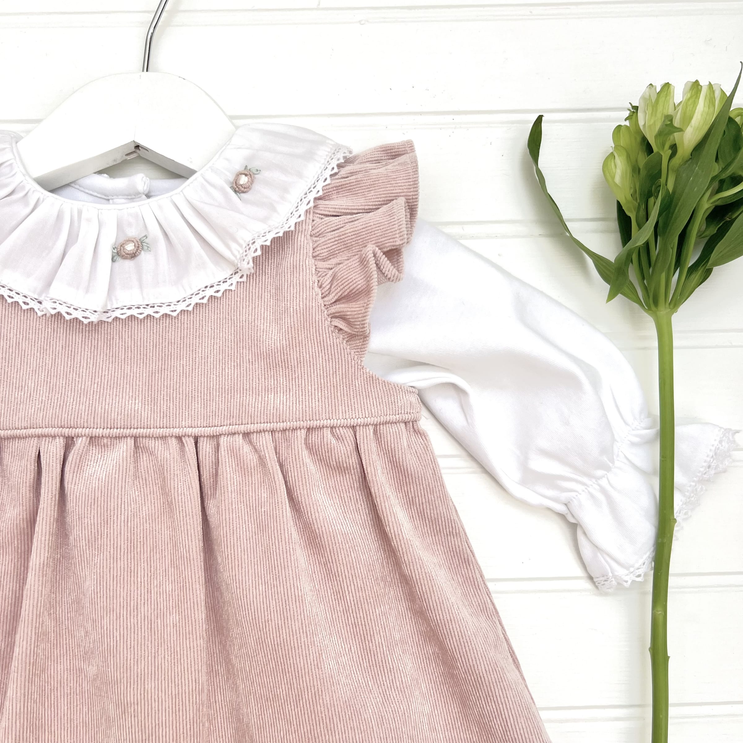 Jumper cot alitas rosa