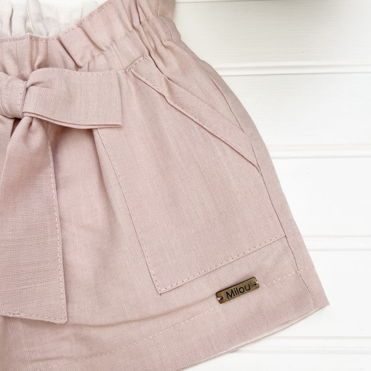 Short niña lazo lino rosa